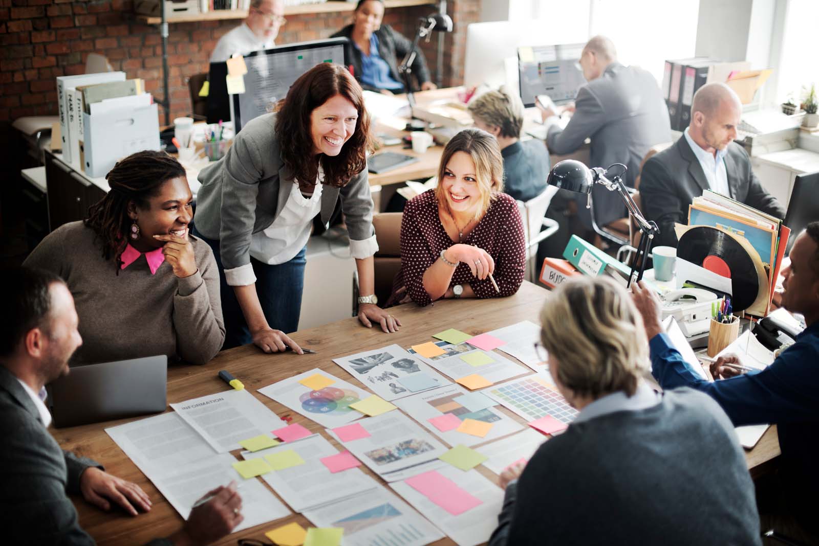 A photograph of office colleagues in a meeting.