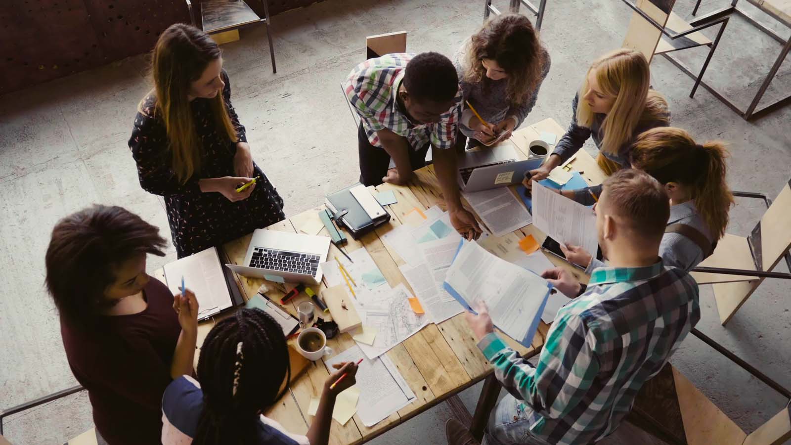 A photograph of office colleagues in a meeting.