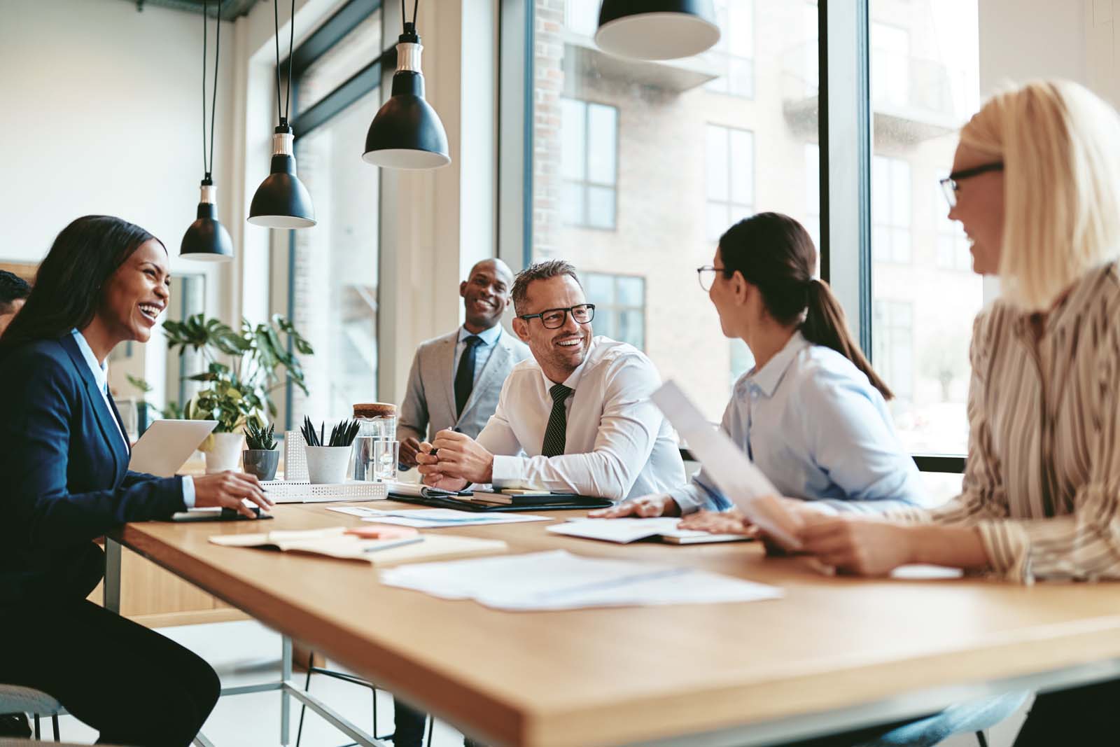 A photograph of office colleagues in a meeting.