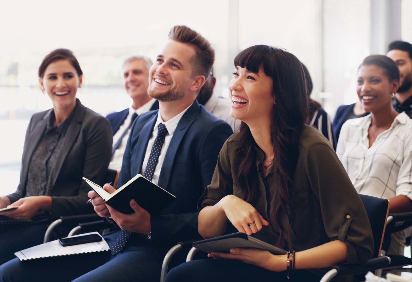 A photograph of office colleagues in a meeting.